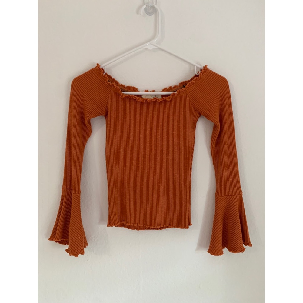 Orange off the shoulder bell sleeve top.